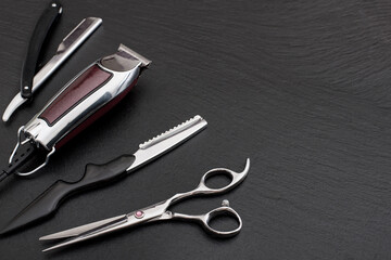 Barber shop tools on Black with place for text.