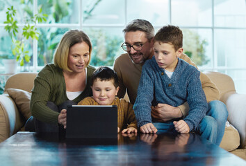 Fototapeta premium What do you feel like watching. Shot of a family using a digital tablet together.