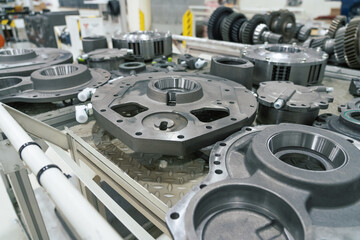 Vehicle metal parts in factory. Production line for assembly industrial tractors.