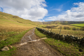 Fototapeta na wymiar An ascent of High Cup Nick along the Pennine Way from Dufton in Westmorland