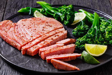 fried tuna steak with boiled broccolini and lime