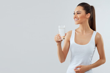 Water glass. Beautiful girl hold water. White background isolated. Drink water. Diet concept
