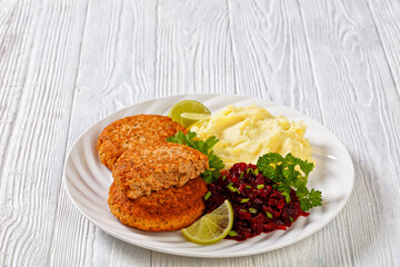 salmon patty with potato mash and beetroot salad