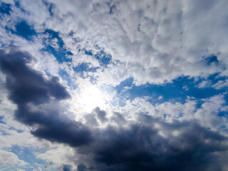 Obraz premium Dramatic sky cloudscape with sun