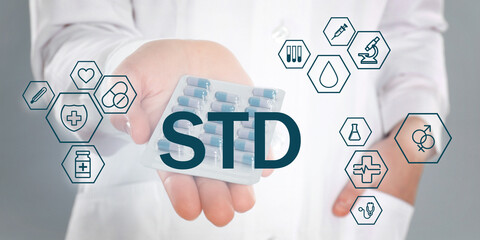 STD prevention. Closeup view of doctor with pills, abbreviation and different icons on light background, banner design