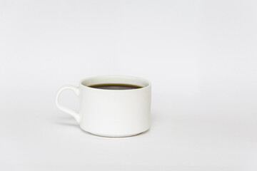 Obraz na płótnie Canvas A cup of coffee. White cup with coffee isolated on white background. Coffee cup. Breakfast. Coffee drink.