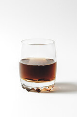 glass of cognac isolated on white background
