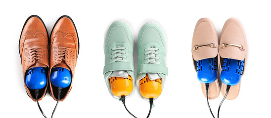 Top view of dIfferent stylish footwear with electric shoe dryers on white background, collage. Banner design