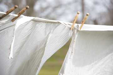Old-fashioned laundry on a clothesline with wooden clips