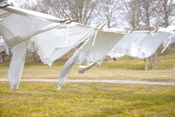 Old-fashioned laundry on a clothesline with wooden clips