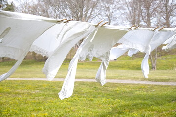 Old-fashioned laundry on a clothesline with wooden clips