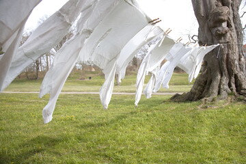 Old-fashioned laundry on a clothesline with wooden clips