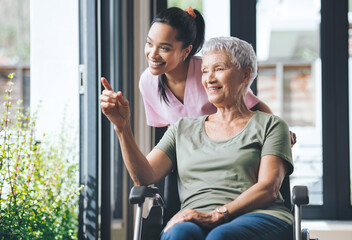 I remember it like it was yesterday. Shot of a young nurse standing beside an older woman in a wheelchair.