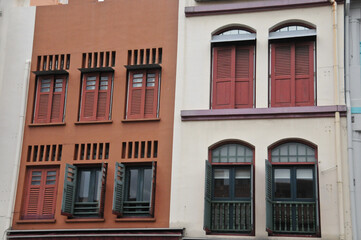 Classical dark orange and white grey front of town houses in Singapore in cloudy day