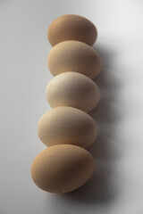 Brown chicken eggs, eggs on white background, selective focus