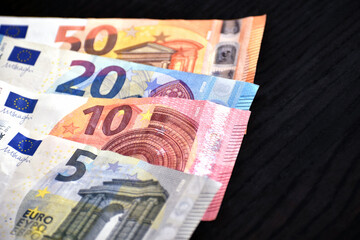 Euro money banknotes on wood table.  5, 10, 20 and 50 Euro notes background. 