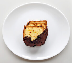 Three pieces of sweet cupcake on a white plate for breackfast