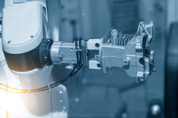 The hi-technology  material handling process by robotic system with cylinder block parts.