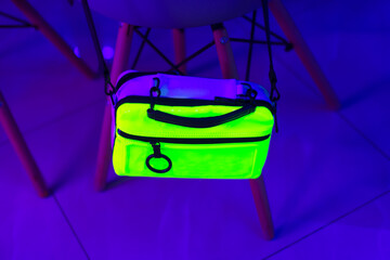 bright colored women bag in neon lighting