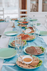 beautifully laid tables with glasses and appliances at morning in restaurant. Empty glasses