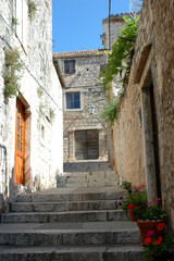 Narrow streets between the old stone houses in the town of Hvar, in Croatia