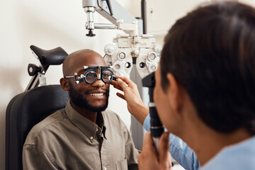 It was clarity at first sight. Shot of an young man getting new glasses fitted by an optometrist.
