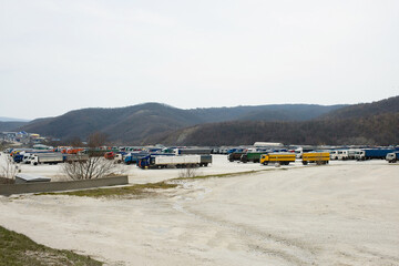 Fototapeta na wymiar Parking with trucks during transportation. Truck rest area. Logistics