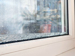 Water condensate drops on window glass. The problem of humidity.