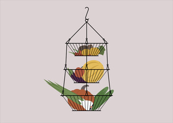 A layered hanging vase with fruits and vegetables, farmers market food