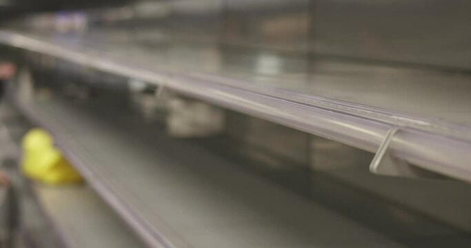 View of empty supermarket shelves, grocery store work stoppage closes, sanctions and embargo, panic buying with supplies and goods shortage, food crisis and deficit concept
