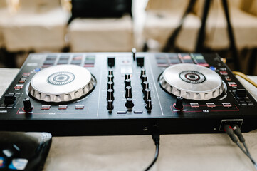 Obraz premium DJ music night club, DJ technique - CD players, and DJ console during the party. Mixing desk, house music party.