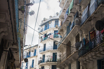 Fototapeta na wymiar French colonial architecture: houses, windows, balconies. Major part of Algiers city was built by French during 1830-1962 years, Algiers, Algeria