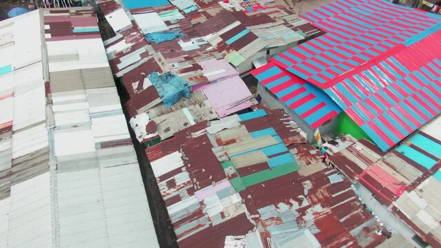 Dense packed village houses on ocean beach coast in Monrovia, Liberia in West Africa