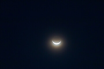 Naklejka na ściany i meble Crescent moon on night sky. Look like a beautiful smile.