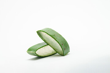 ORGANIC / NATURAL Aloe vera slice on white background,  with copy space. (Aloe barbadensis Mill.,Star cactus, Aloe, Aloin, Jafferabad or Barbados) a very useful herbal medicine for skin  and hair care
