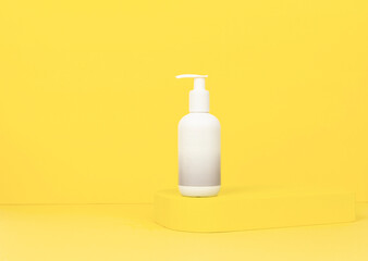 soap bottle on yellow background