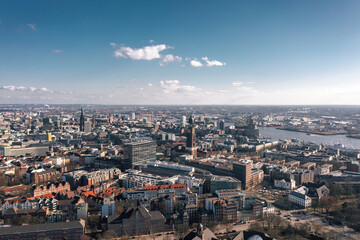 Fototapeta na wymiar Cityscape of Hamburg, Germany, on the sunny day. Aerial panoramic view on the city center, Hafencity and St Pauli district