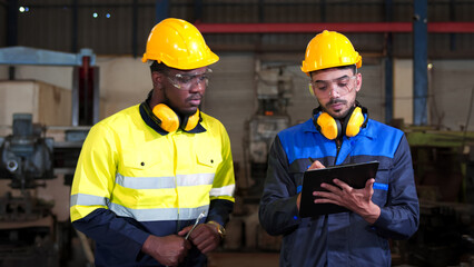 Diversity, colleague of industry heavy team engineer. Professional inspection, technician, worker wearing safety uniform, helmet, hardhat while checking maintenance machine line production factory.