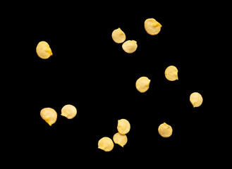 Pepper seeds isolated on black background.