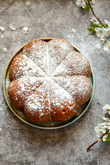 Homemade  Italian style  Easter  bread cake, spring blossom  and  hand colored eggs. Homemade pastry.  Easter holiday baking and decorarion