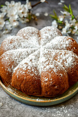 Homemade  Italian style  Easter  bread cake, spring blossom  and  hand colored eggs. Homemade pastry.  Easter holiday baking and decorarion