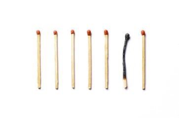 Burnt matches on a white background. The concept of burnout syndrome at work