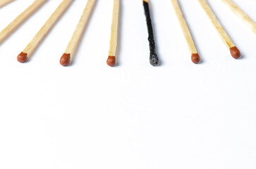 Burnt matches on a white background. The concept of burnout syndrome at work. Copy space.
