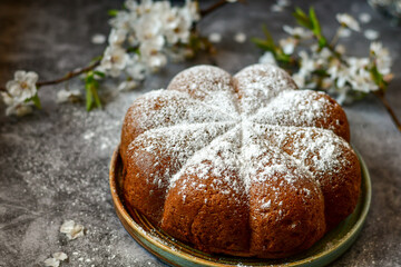Homemade  Italian style  Easter  bread cake, spring blossom  and  hand colored eggs. Homemade pastry.  Easter holiday baking and decorarion