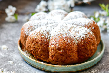 Homemade  Italian style  Easter  bread cake, spring blossom  and  hand colored eggs. Homemade pastry.  Easter holiday baking and decorarion