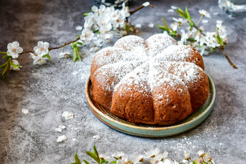 Homemade  Italian style  Easter  bread cake, spring blossom  and  hand colored eggs. Homemade pastry.  Easter holiday baking and decorarion