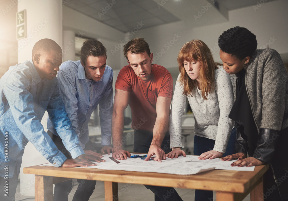 Aufkleber collaboration is key. cropped shot of architects working together on a project in an office.