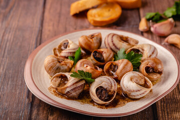 snails with butter on a plate