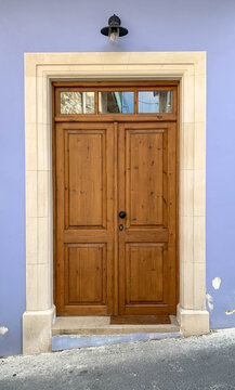 Old brown wooden door with glasses. Details Classic vintage door