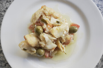 Top View of Portuguese Cod Fish Casserole. Home-made edition of a Portuguese Bacalhoada. 